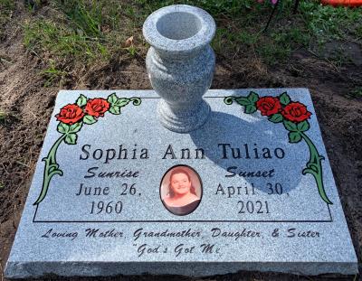 flat granite headstone with roses